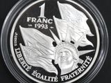 a close up of a coin with a statue of liberty on it