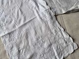 two towels that are laying on a bed