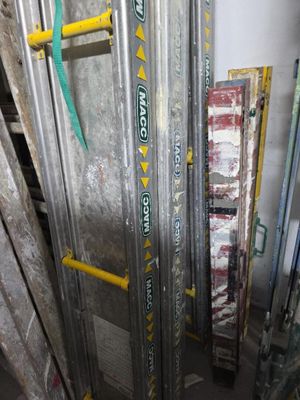 a ladder that is leaning against a wall in a room