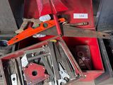 many tools in a red box on the floor