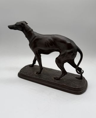 an image of a statue of a dog on a wooden base