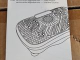 a cardboard box with a picture of a shoe on it