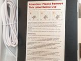 a box with a cable and a charger inside of it