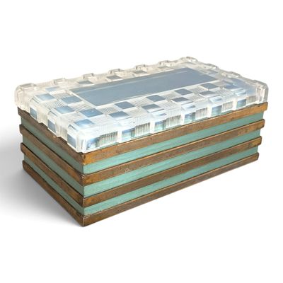 a glass box that is sitting on top of a wooden table