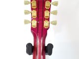 an image of a close up of a guitar neck with a white background
