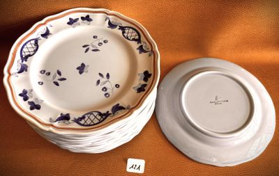 two plates and a bowl sitting on a table