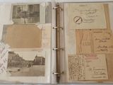 an open book with a bunch of old photos on it