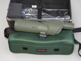 a green case with a green binoculars on top of it