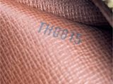a close up picture of a purse with the word thomas written on it