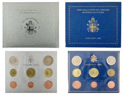 a set of four different british coins in a blue box