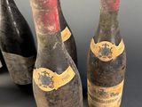 three bottles of wine sitting next to each other on a table