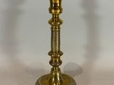 pair of antique brass candlesticks on a white background