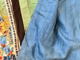 several pieces of clothing are laid out on a table