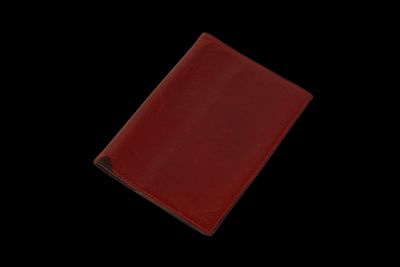 an image of a red wallet on a black background