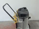 an image of a vacuum cleaner on the floor in a room