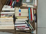 a box full of books sitting on the ground
