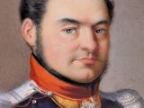 portrait of a man in a blue uniform with a red collar