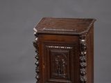 an old wooden cabinet with carvings on the front and sides