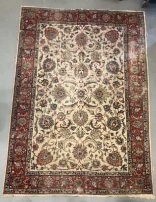 an antique persian rug is on display in a shop
