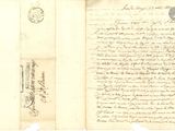 un vieux document comportant des inscriptions et un cachet