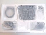 a white box with some items in it on a table