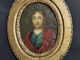 an old painting of a woman in a red cloak is hanging on a wall