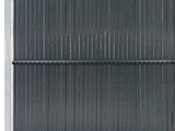 a close up view of a black grill grate