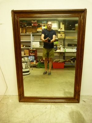 a man taking a picture of himself in a mirror