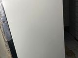 a white refrigerator sitting in a kitchen next to a counter