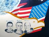 une image d'une affiche sur laquelle figurent des astronautes