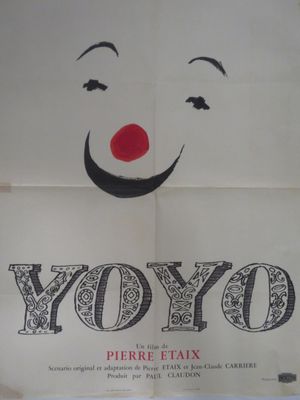 une affiche blanche sur laquelle figurent un nez rouge et un sourire