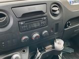 dashboard of a truck with a bunch of hay in the back of it