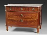 an antique chest of drawers with marble top