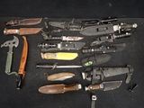 many different types of knives and knives on the table