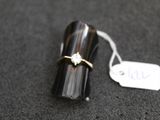 a ring that is sitting on top of a black object