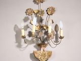 a wall light that has a bunch of flowers on it
