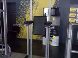 an image of a gym room with equipment in it