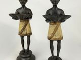 pair of african figurines of a woman holding a tray