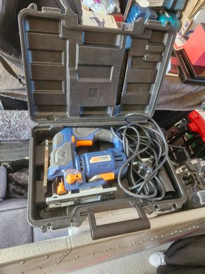 a tool box with tools in it sitting on the floor