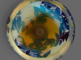 a glass bowl with blue and yellow flowers on it