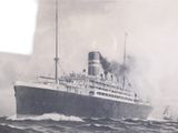a black and white photo of a large ship in the water