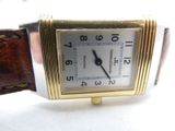 an image of a close up of a wrist watch on a white surface