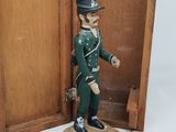 a wooden box with a toy soldier inside of it