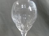 a wine glass that is sitting on a table