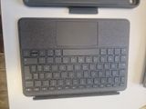 a keyboard and a mouse on a table next to each other