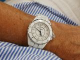 a person that is wearing a watch on their wrist