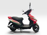 the scooter is red and white with a green and red stripe on the side
