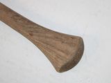 a wooden baseball bat laying on a white surface