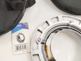 a camera lens and a bag on a table