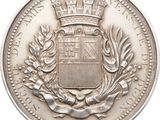 an old silver coin with a crown on top of it